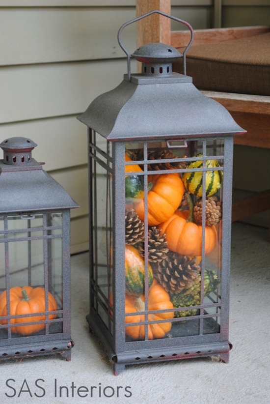 Mini pumpkins and gourds in a lantern for Fall. So cute! Good for an area of the house you don't want to use candles.